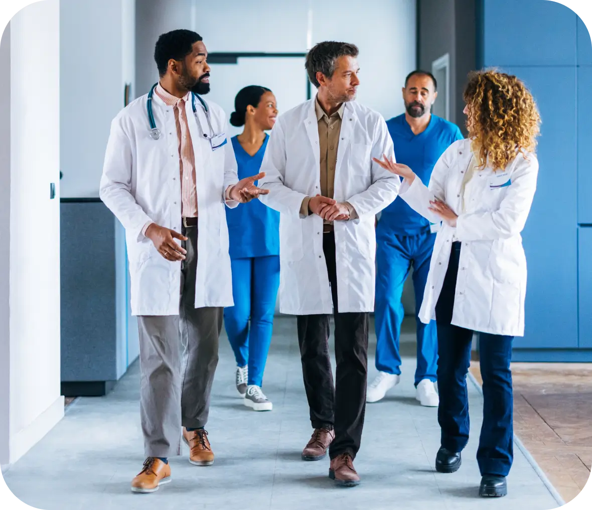 Healthcare professionals in conversation at hospital